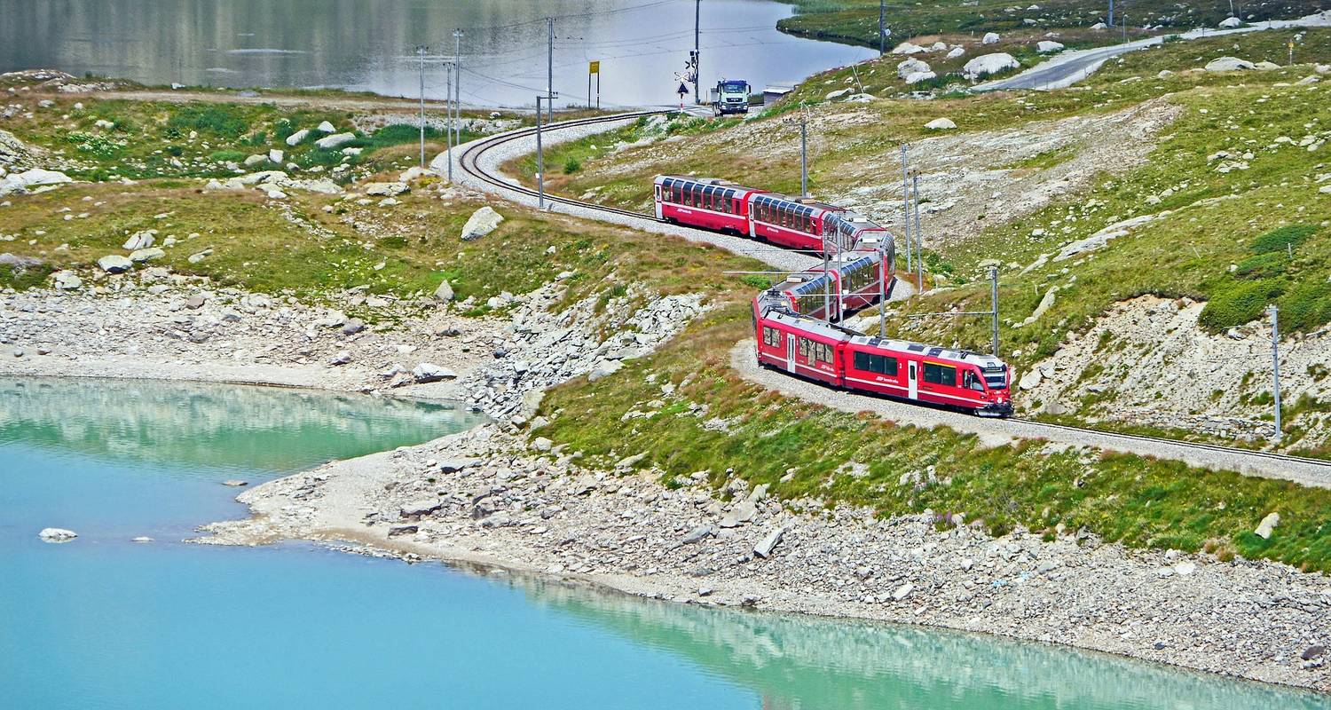 Bernina Red Train crossing Swiss Alps UNESCO World Heritage railway