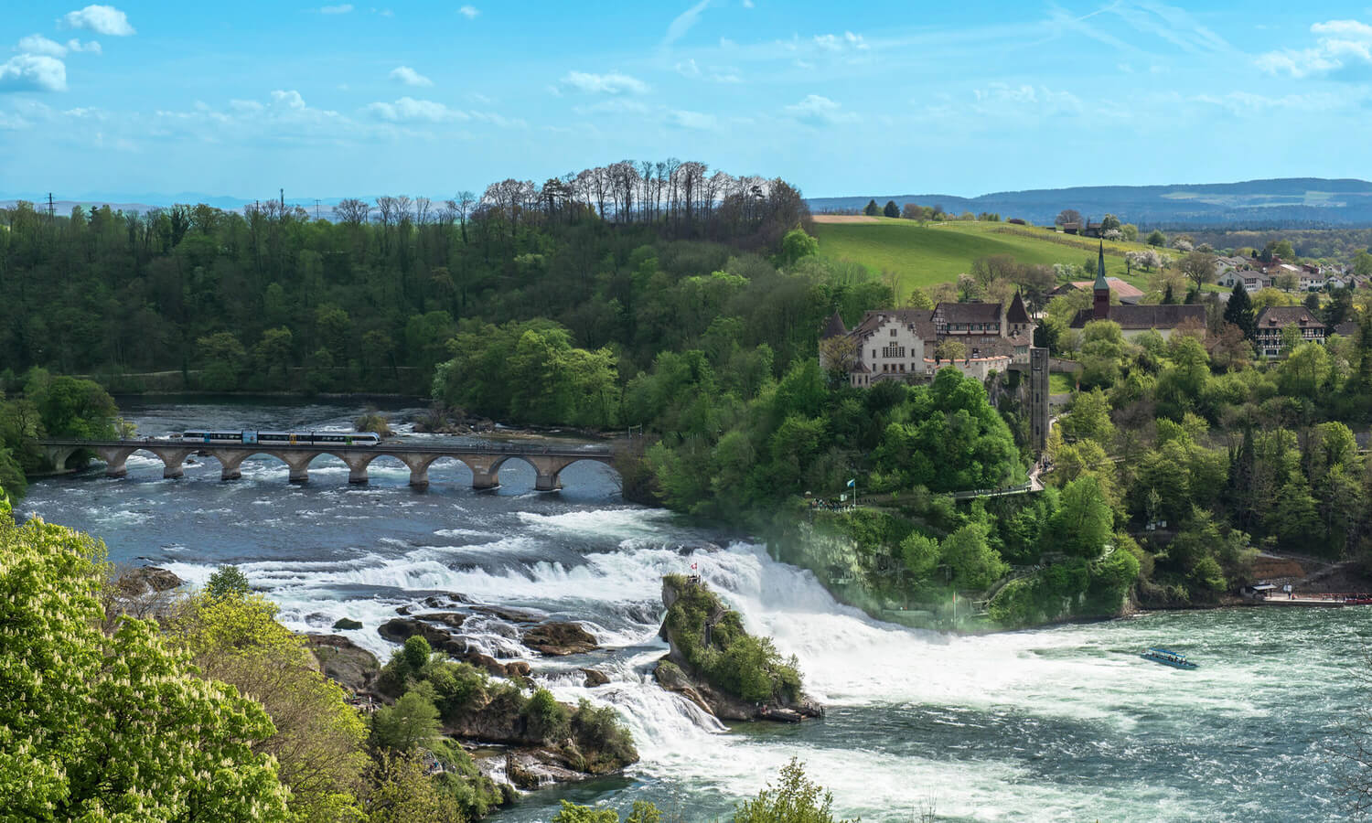 Emerald green waters and cliffs at Rhine Falls Switzerland
